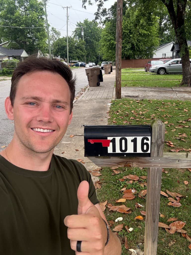 Mailbox Bros team member at a completed mailbox install with house number 1016